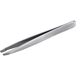Eine silberne Pinzette aus Metall liegt quer im Bild.